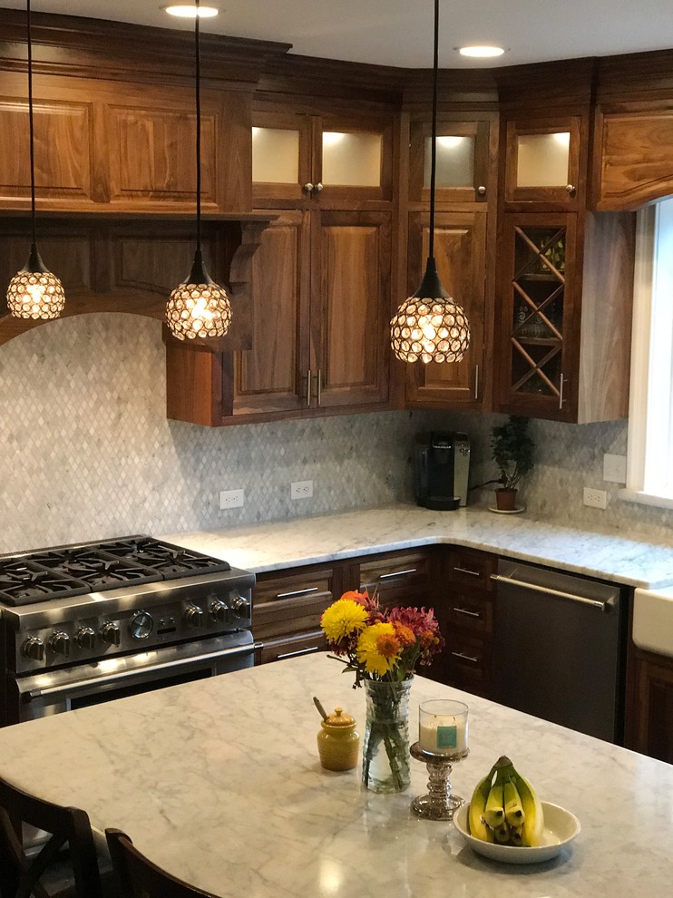 Example of a mid-sized mountain style l-shaped porcelain tile and beige floor eat-in kitchen design in New York with a farmhouse sink, raised-panel cabinets, dark wood cabinets, stainless steel appliances, quartzite countertops, beige backsplash, mosaic tile backsplash, an island and white countertops
