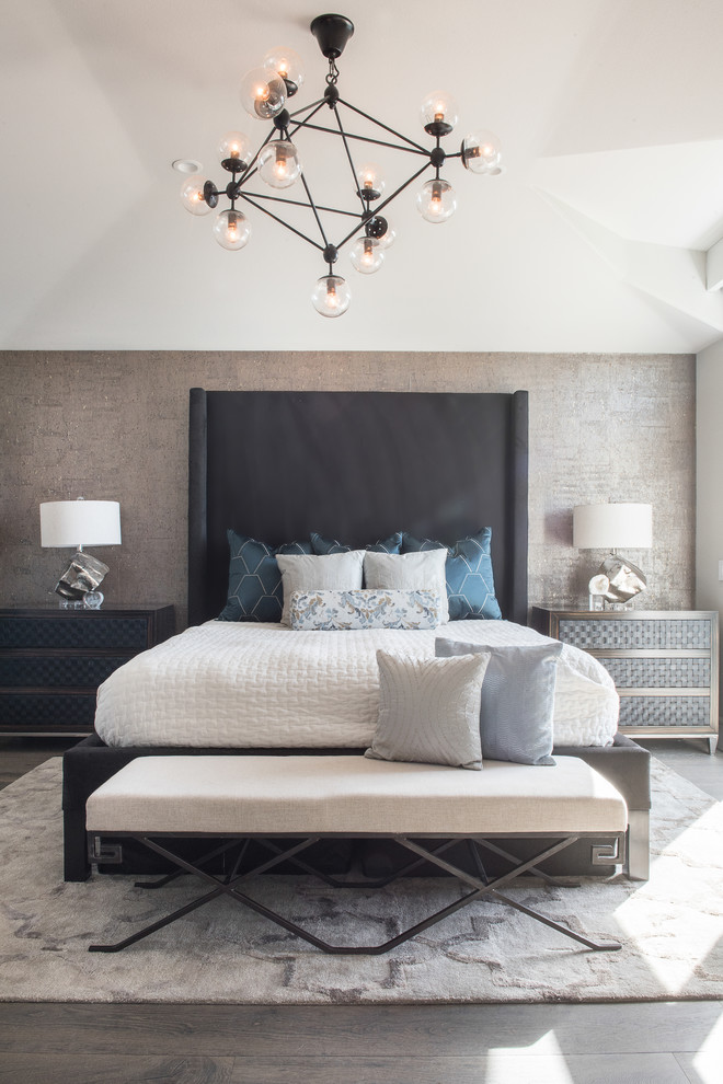 Design ideas for a mid-sized transitional master bedroom in Orange County with grey walls, light hardwood floors and grey floor.
