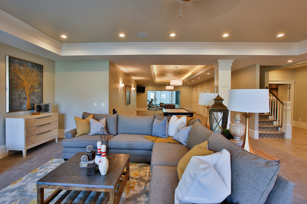 Design ideas for a large transitional open concept family room in Salt Lake City with beige walls, carpet, a standard fireplace, a wood fireplace surround, a wall-mounted tv and a game room.