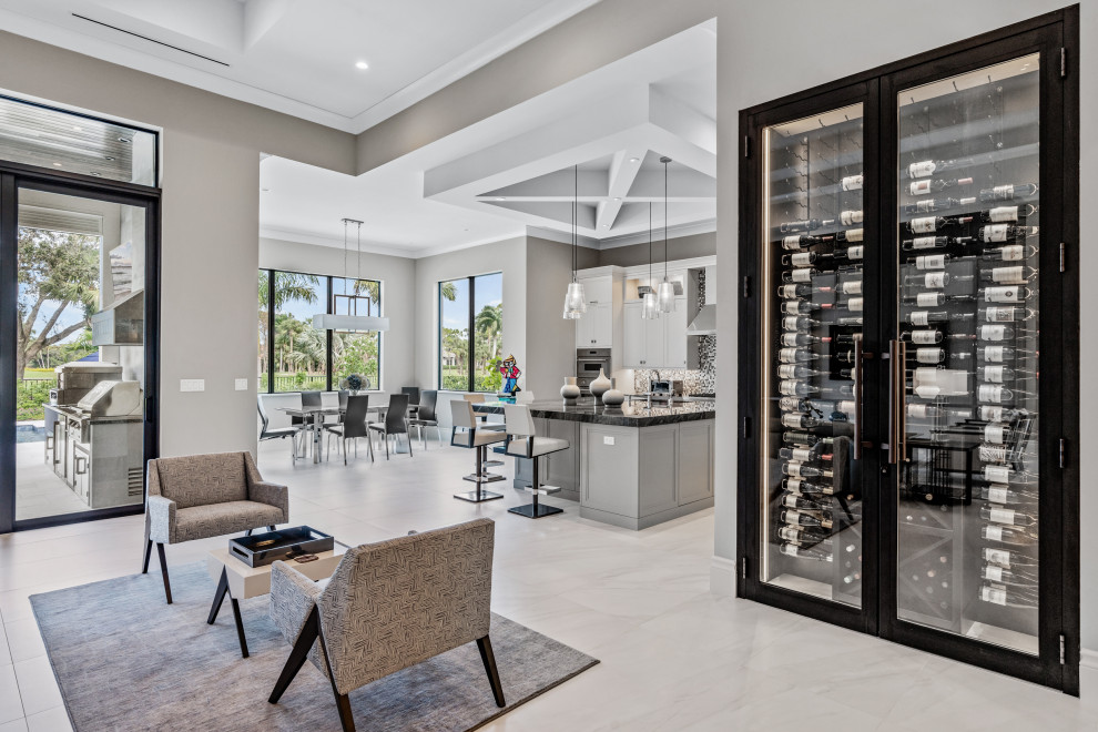 Design ideas for a large modern wine cellar in Miami with porcelain floors, storage racks and white floor.