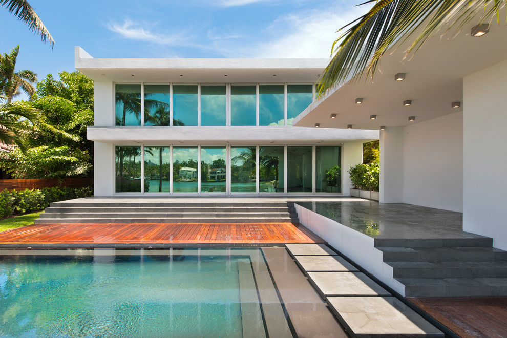 Inspiration for a large contemporary backyard rectangular pool in Miami.