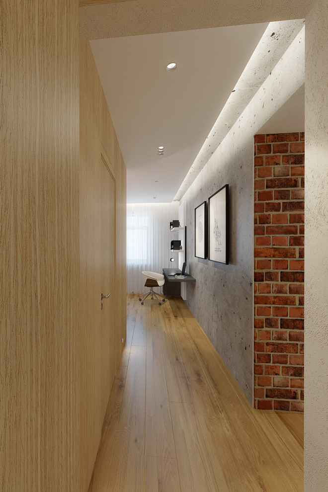 Example of a small trendy light wood floor hallway design with multicolored walls