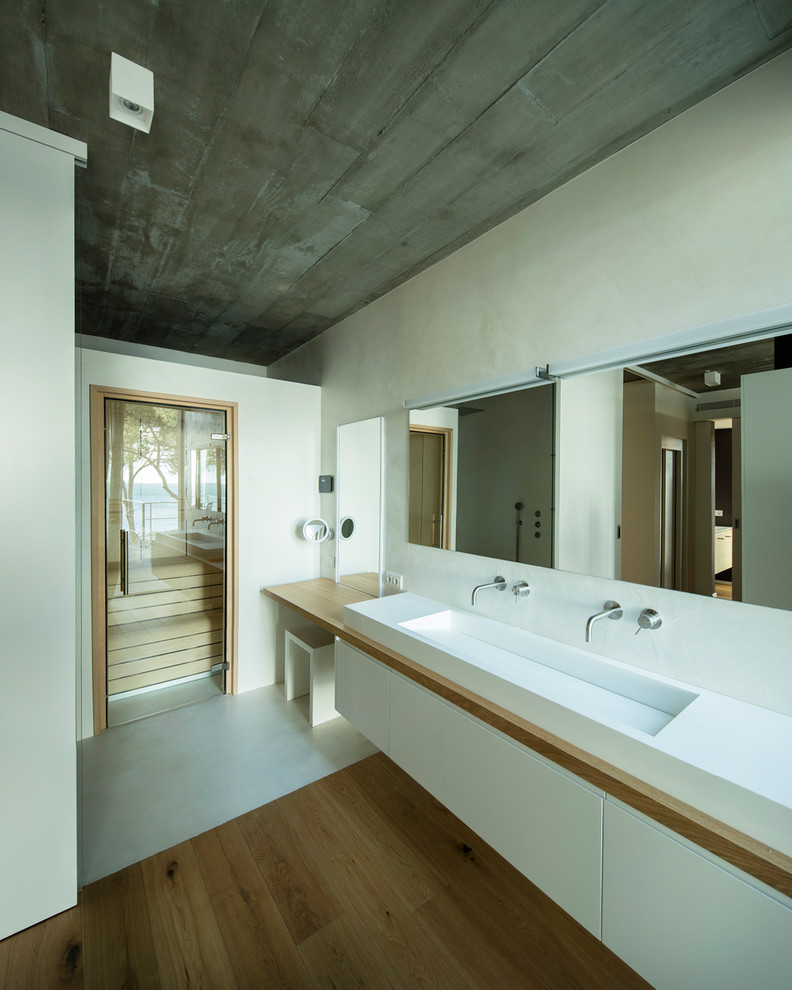Photo of a contemporary bathroom in Other with a trough sink.