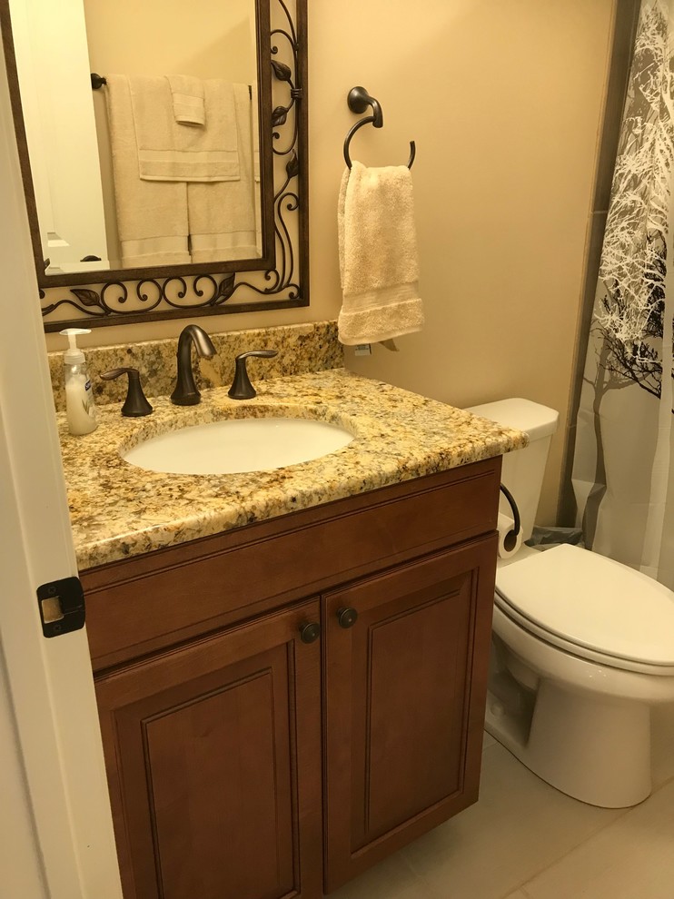 Finished Basement Bathroom with ceramic tiled floor and tub