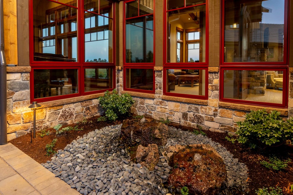 Inspiration for a large rustic brown two-story wood gable roof remodel