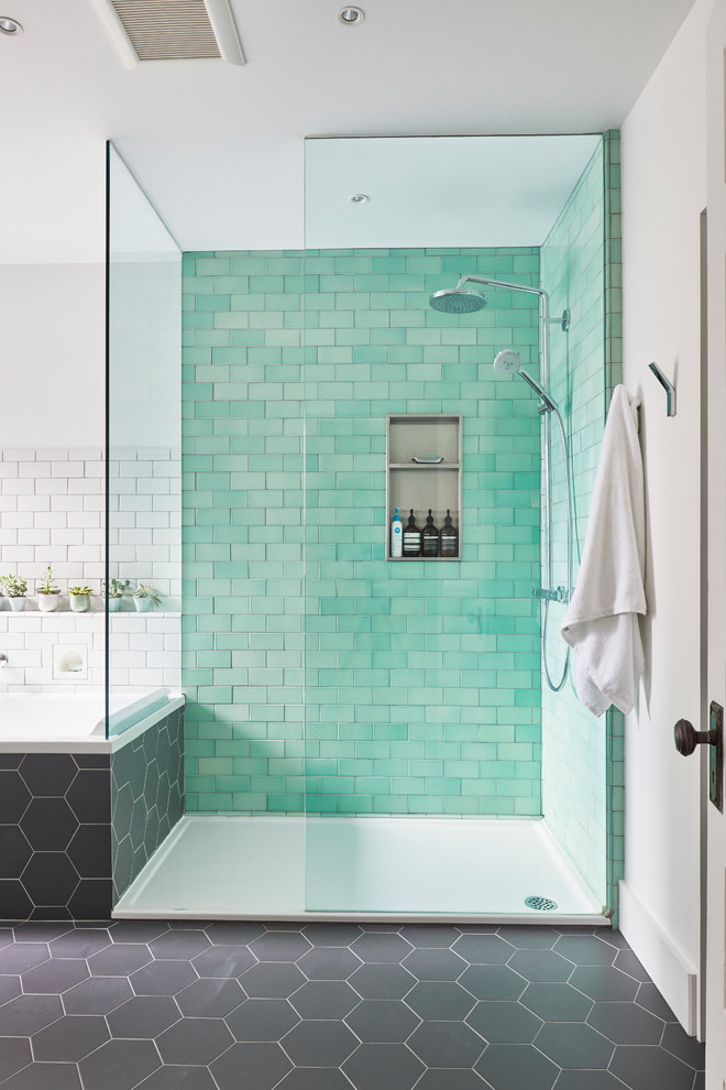 This is an example of a large scandinavian master bathroom in Toronto with a drop-in tub, a curbless shower, a wall-mount toilet, green tile, subway tile, white walls, ceramic floors, a wall-mount sink, grey floor and an open shower.