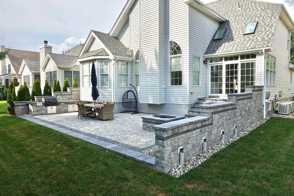 Manalapan, NJ: Patio with water features, firepit & kitchen