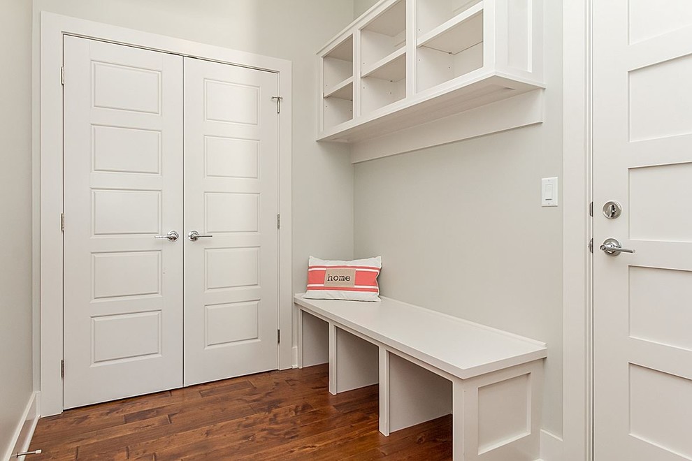 Mudroom - mid-sized transitional medium tone wood floor and multicolored floor mudroom idea with gray walls and a white front door