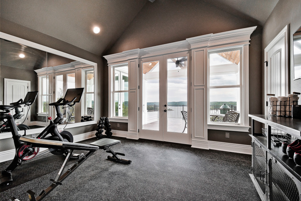 This is an example of a small arts and crafts multipurpose gym in Other with brown walls and black floor.