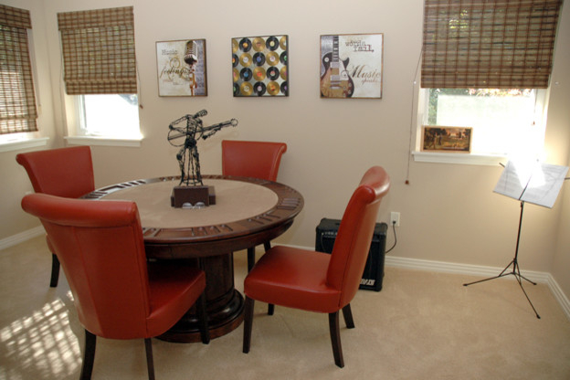 Photo of a traditional home office in Portland with beige walls and carpet.