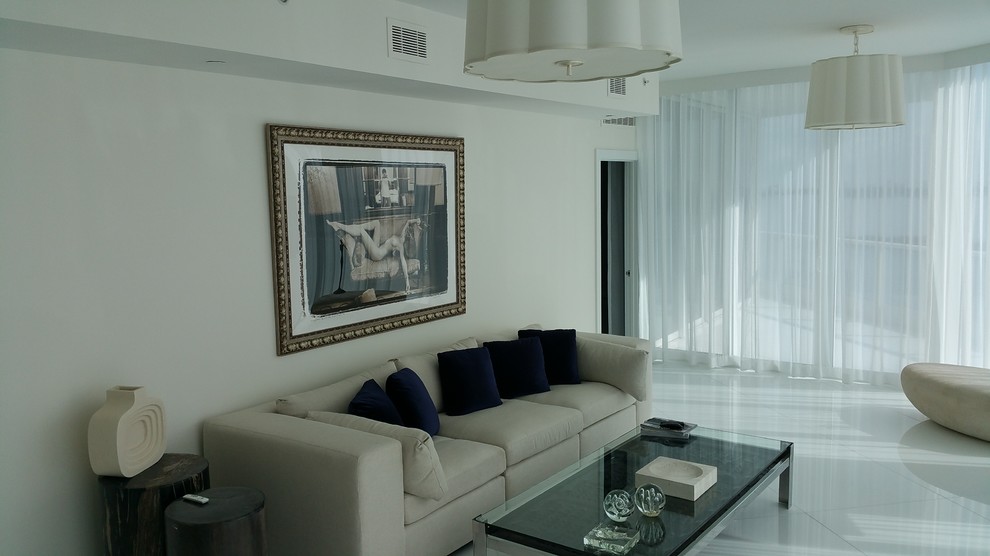 Large modern formal open concept living room in Miami with white walls, porcelain floors, no fireplace and a wall-mounted tv.
