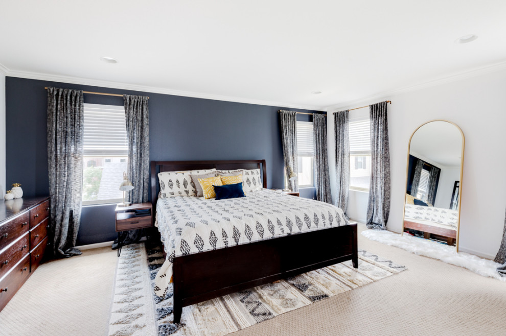 Design ideas for a large modern master bedroom in Denver with blue walls and carpet.