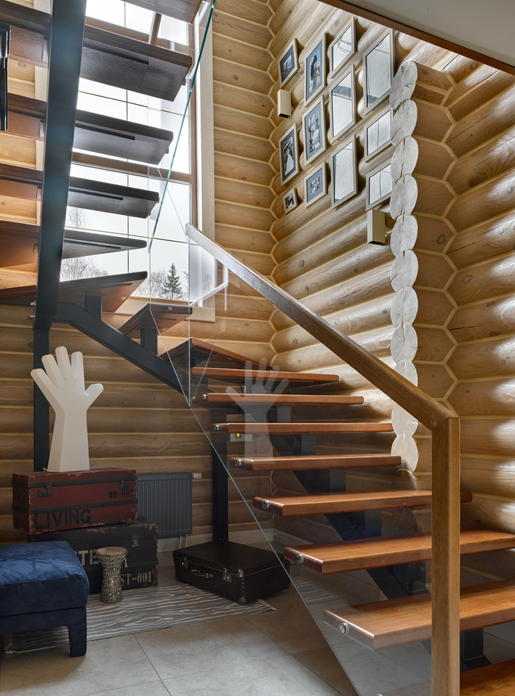 Country wood u-shaped staircase in Other with open risers and mixed railing.