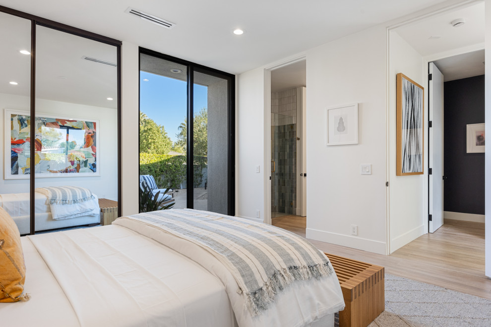 Mid-sized transitional guest porcelain tile and beige floor bedroom photo with white walls and no fireplace