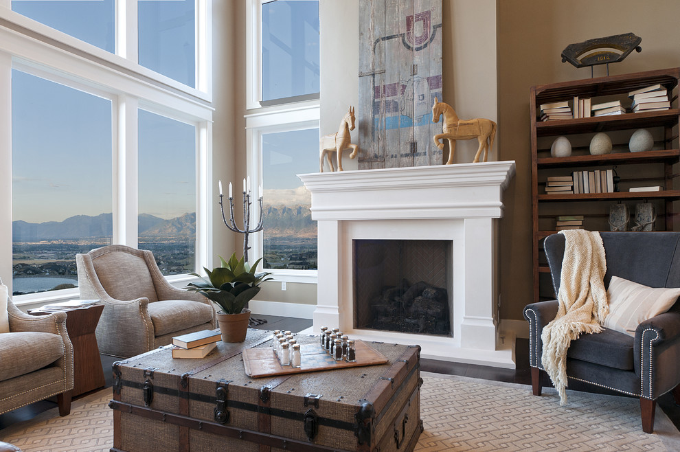 Inspiration for a large arts and crafts open concept living room in Salt Lake City with beige walls, dark hardwood floors, a standard fireplace, a concrete fireplace surround and no tv.