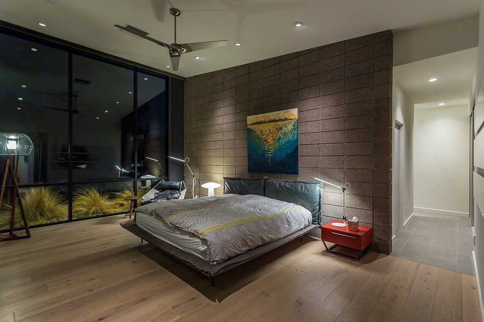 Design ideas for a modern master bedroom in Phoenix with grey walls, light hardwood floors and beige floor.