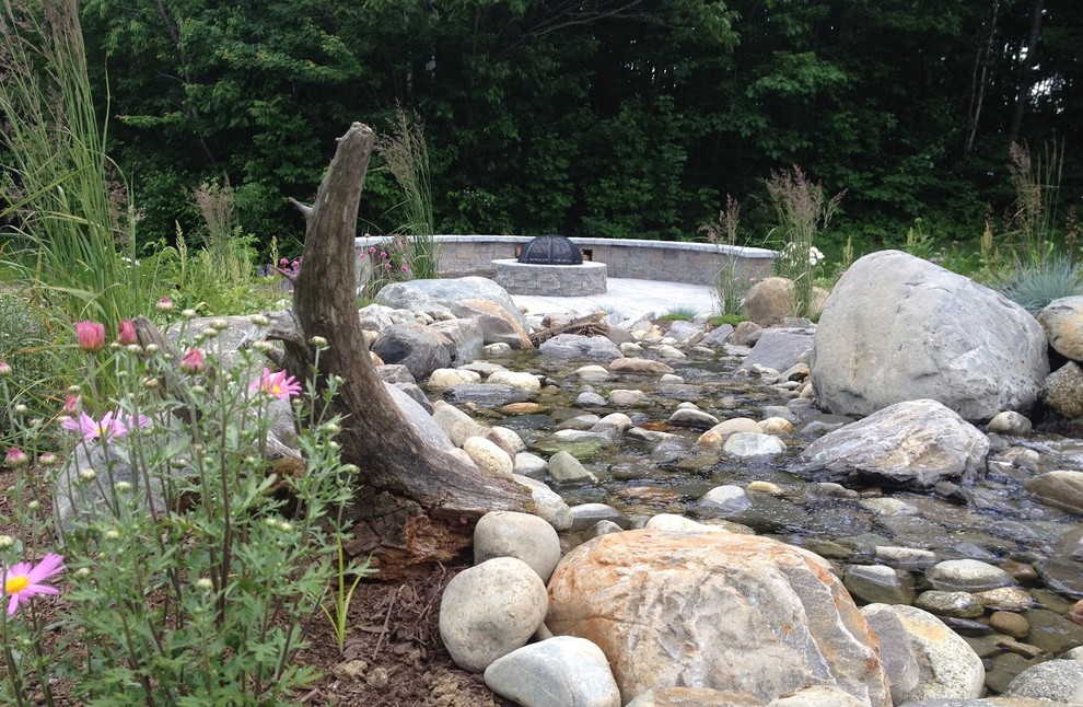 Inspiration for a contemporary backyard garden in Portland Maine with a fire feature.