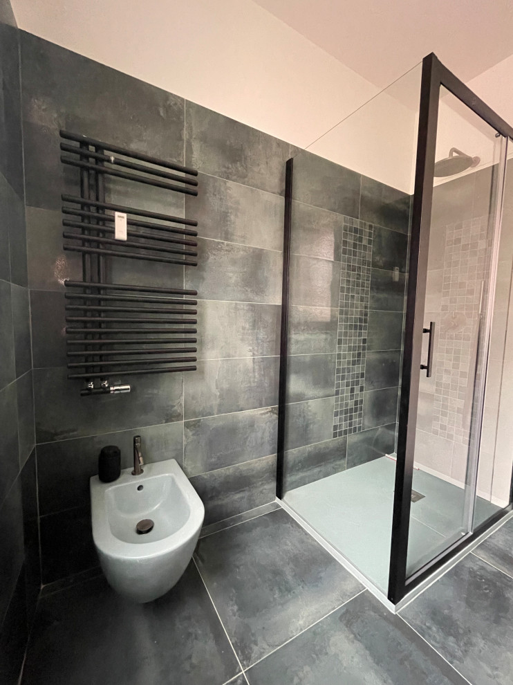 Design ideas for a large contemporary cloakroom in Rome with a wall mounted toilet, green tiles, porcelain tiles, porcelain flooring, a vessel sink, solid surface worktops, green floors, white worktops and a floating vanity unit.