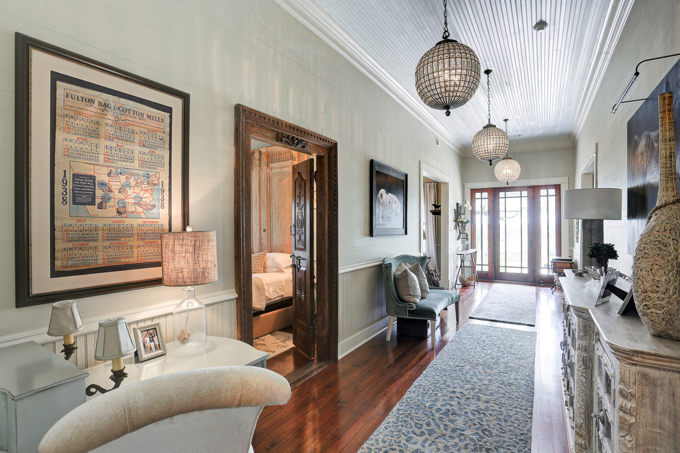 Design ideas for a traditional hallway in Houston with dark hardwood floors, brown floor and grey walls.