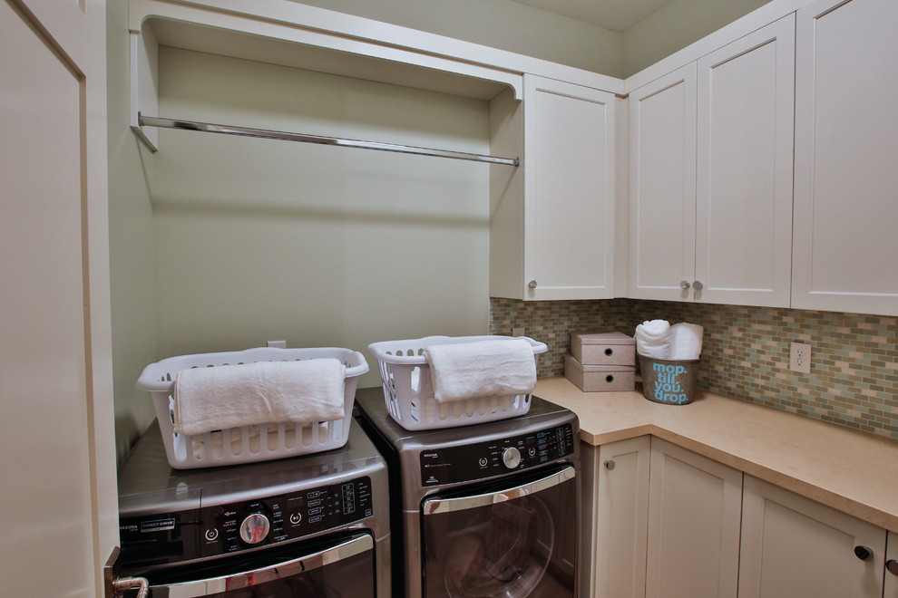 Photo of a large transitional galley dedicated laundry room in Salt Lake City with an undermount sink, shaker cabinets, white cabinets, beige walls, a side-by-side washer and dryer and quartzite benchtops.