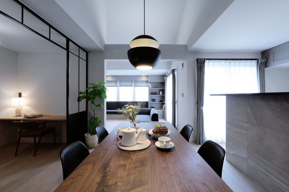 Design ideas for a scandinavian dining room in Other with grey floor.