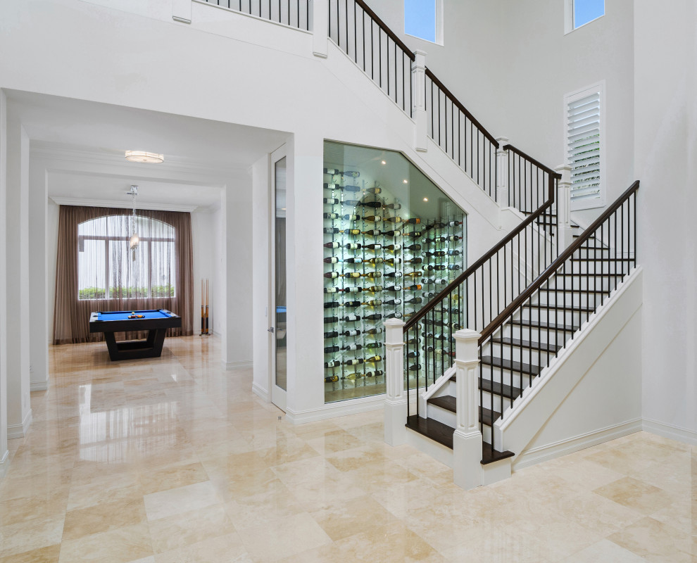 Expansive mediterranean foyer in Miami with white walls, marble floors and beige floor.