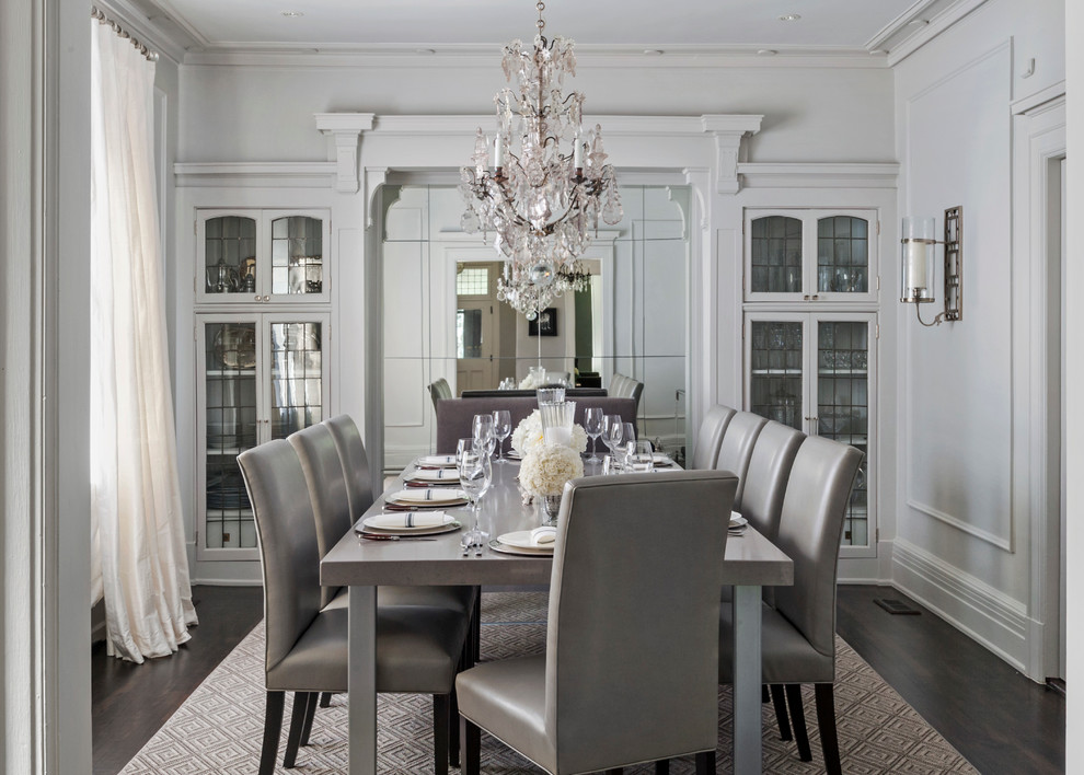 Inspiration for a large traditional separate dining room in Montreal with grey walls, dark hardwood floors and no fireplace.
