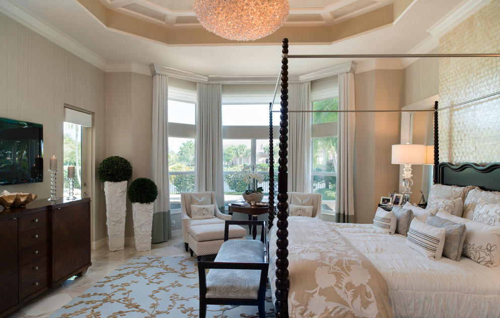 Large traditional master bedroom in Miami with beige walls and marble floors.