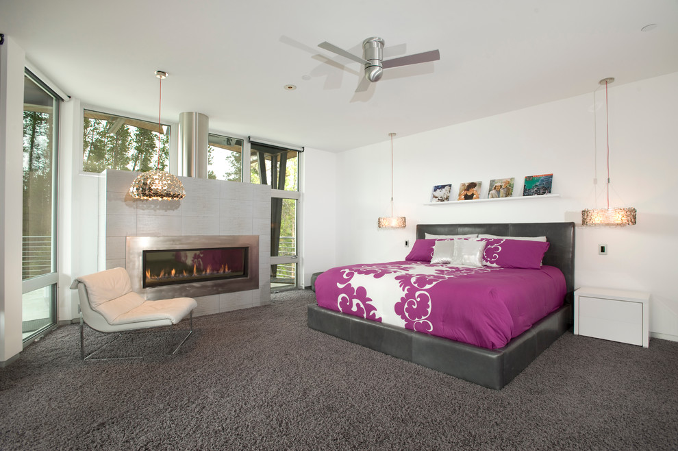 Photo of a contemporary bedroom in Denver with white walls.