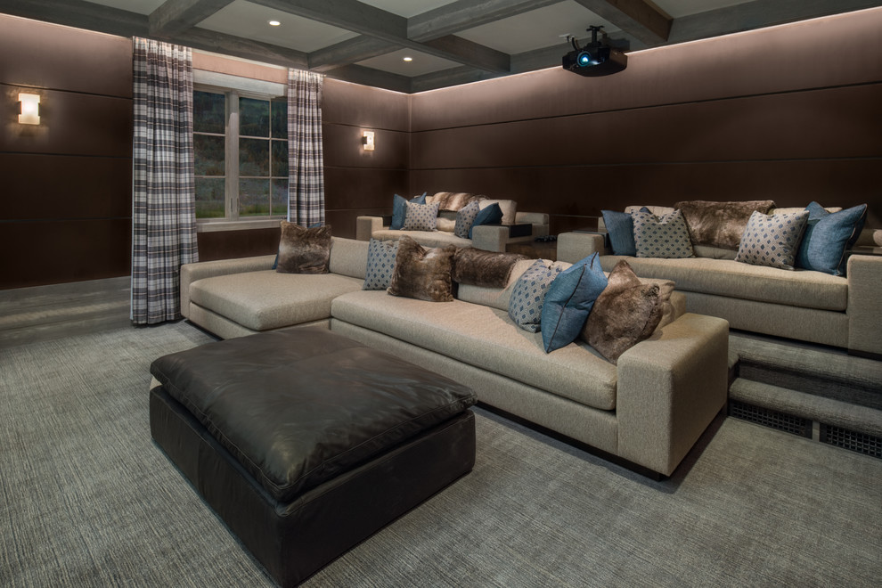 This is an example of a country enclosed home theatre in Other with brown walls, carpet and grey floor.