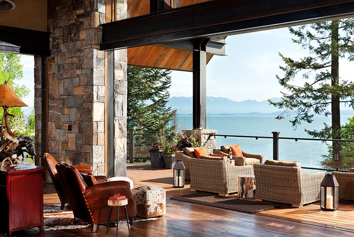 Mountain style balcony deck photo with an awning