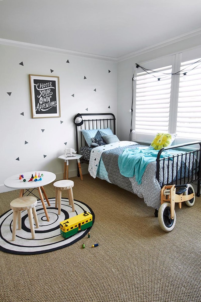 This is an example of a scandinavian gender-neutral kids' room for kids 4-10 years old in Sydney with white walls and carpet.