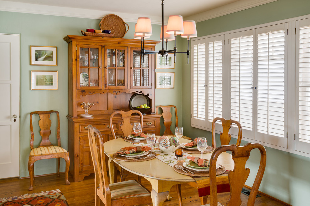 Mid-sized transitional medium tone wood floor dining room photo in San Diego with green walls and no fireplace