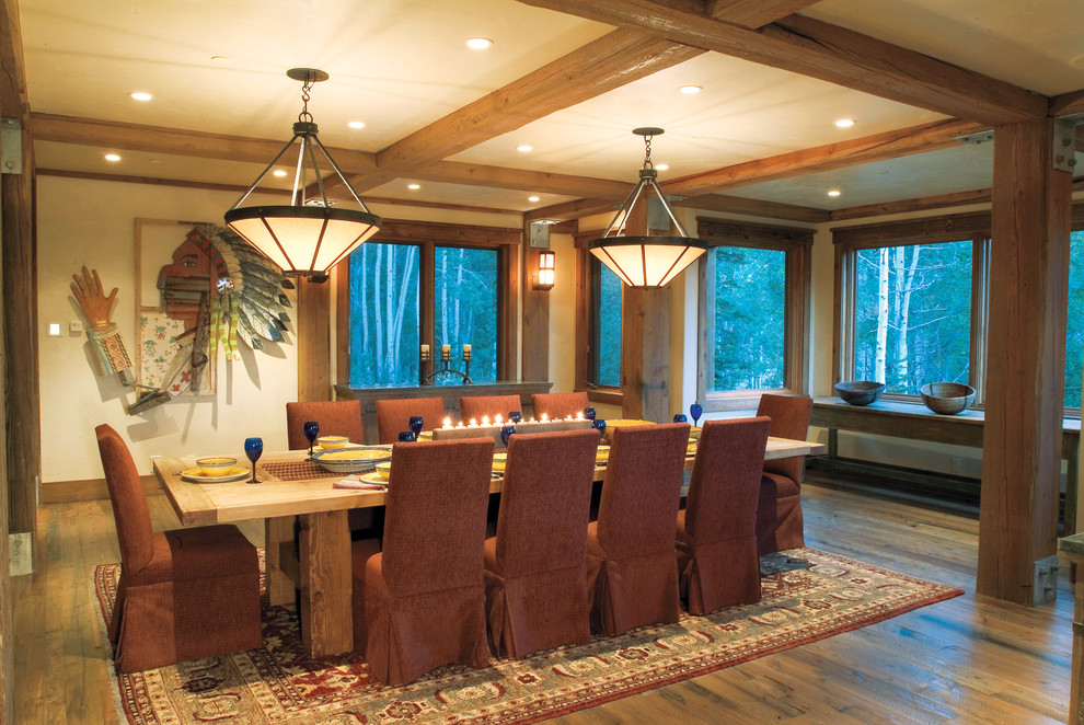 Photo of an expansive country separate dining room in Salt Lake City with blue walls and medium hardwood floors.
