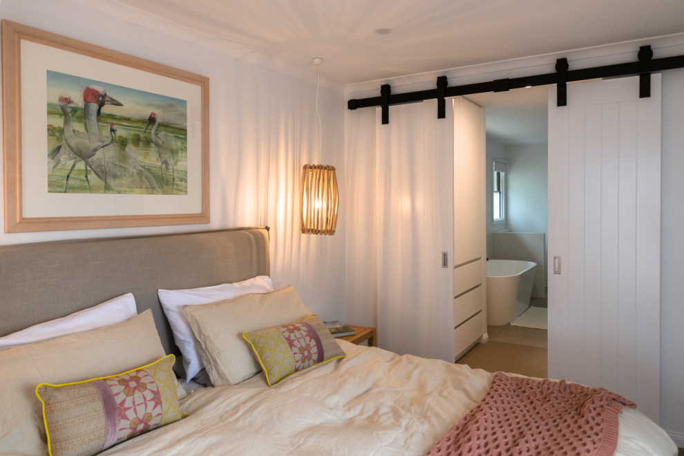 This is an example of a beach style bedroom in Geelong.