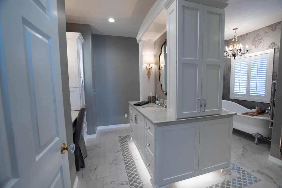 Traditional master wet room bathroom in Other with furniture-like cabinets, white cabinets, a claw-foot tub, grey walls, marble floors, an undermount sink, engineered quartz benchtops, white floor and a hinged shower door.