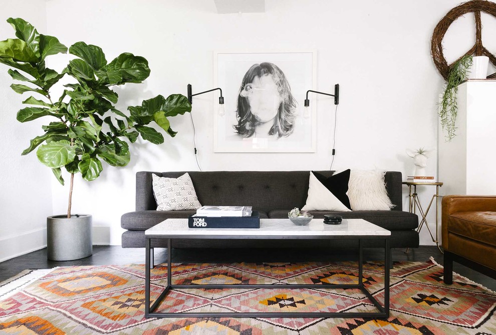 This is an example of a scandinavian living room in Denver with white walls.
