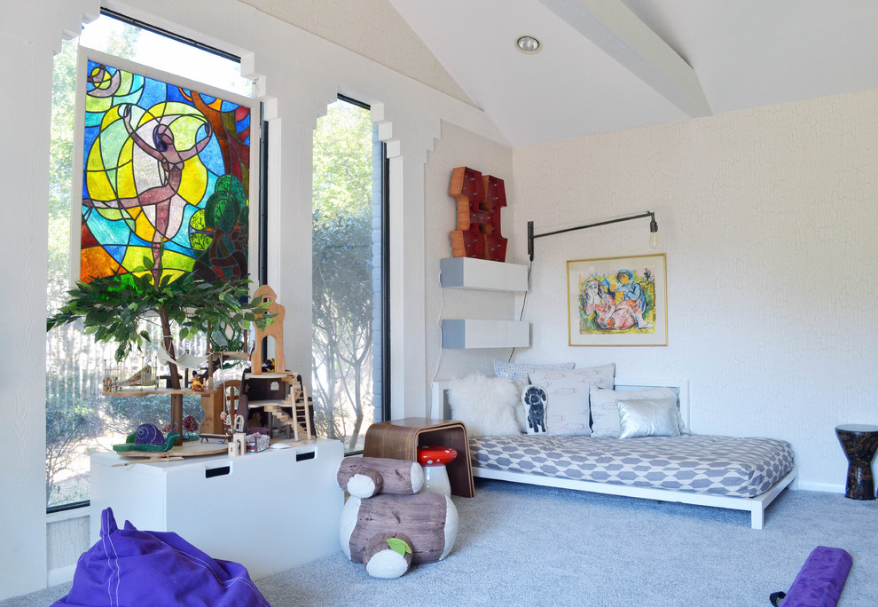 Inspiration for an eclectic gender-neutral kids' playroom for kids 4-10 years old in Dallas with white walls and carpet.