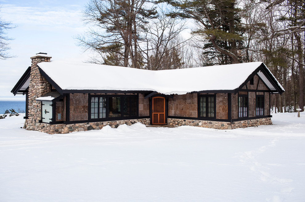 Mid-sized mountain style gray one-story exterior home photo in Other