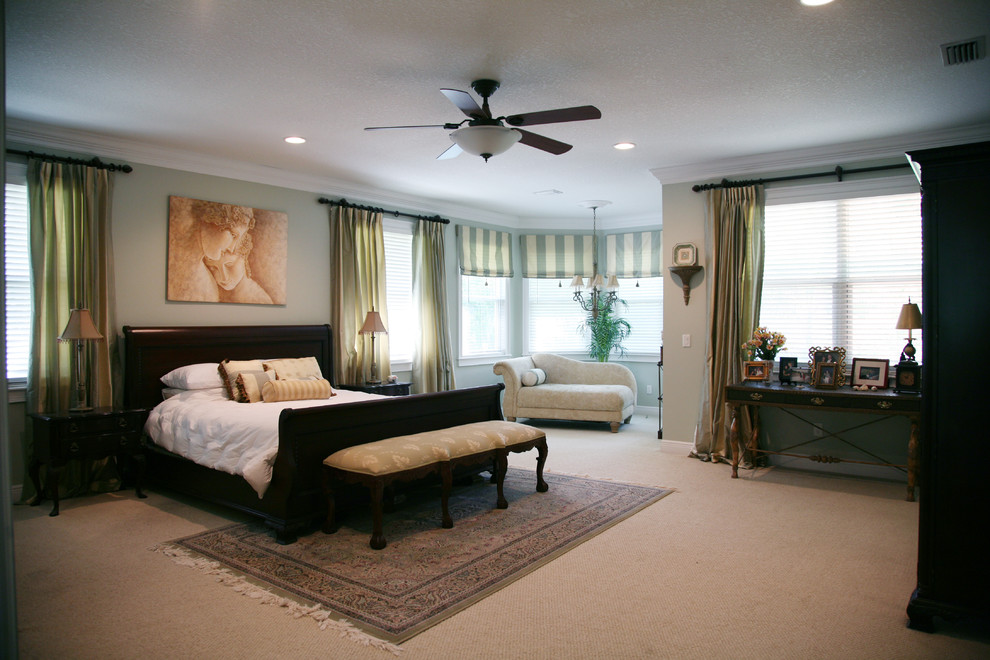 Inspiration for a large traditional master bedroom in Tampa with green walls, carpet and no fireplace.