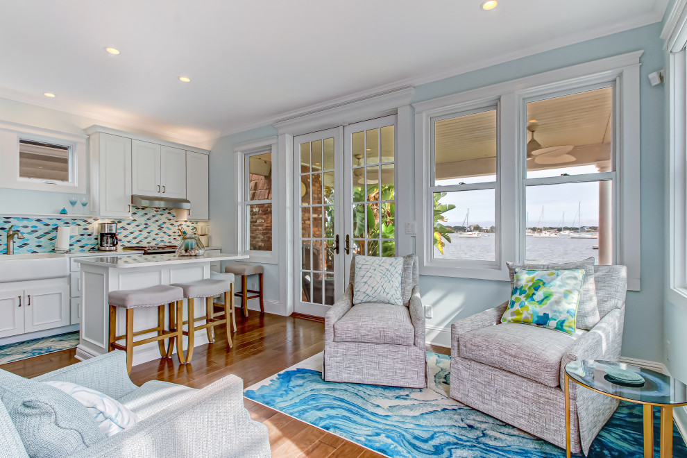 Example of a beach style family room design in Other