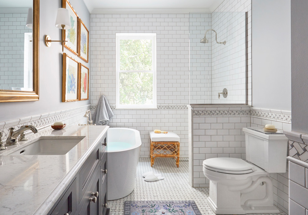 Mid-sized transitional master white tile and cement tile mosaic tile floor, white floor and single-sink bathroom photo in Chicago with shaker cabinets, gray cabinets, a built-in vanity, a one-piece toilet, gray walls, a drop-in sink, quartzite countertops and white countertops