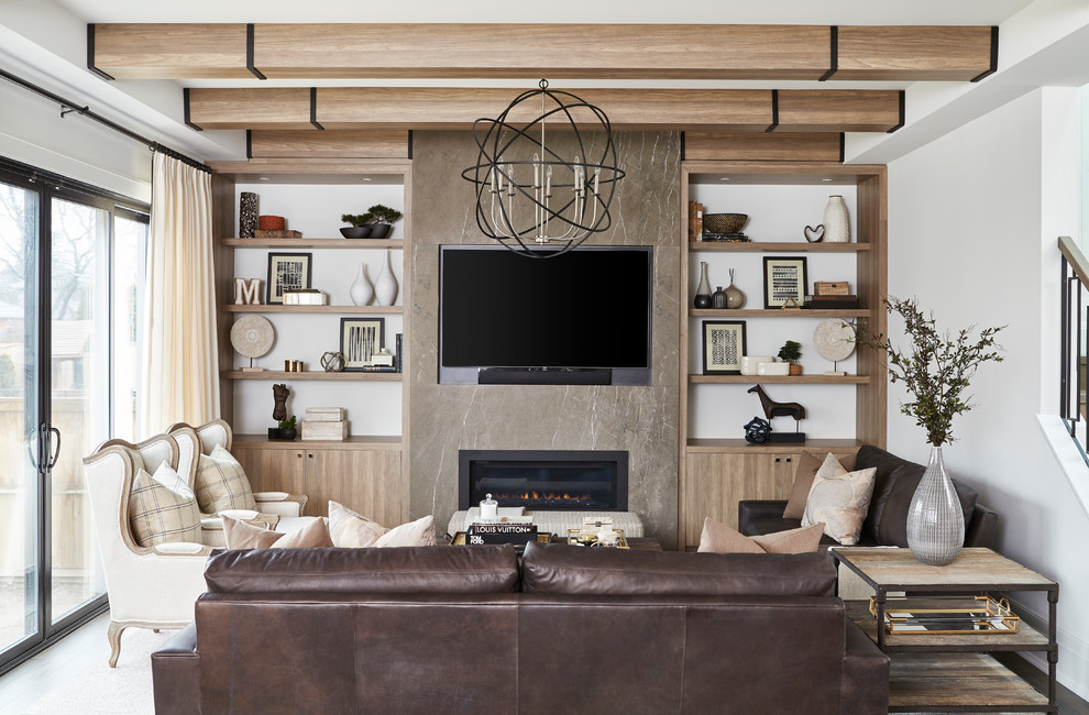 Design ideas for a mid-sized transitional open concept family room in Toronto with white walls, medium hardwood floors, a standard fireplace, a stone fireplace surround, a wall-mounted tv and brown floor.