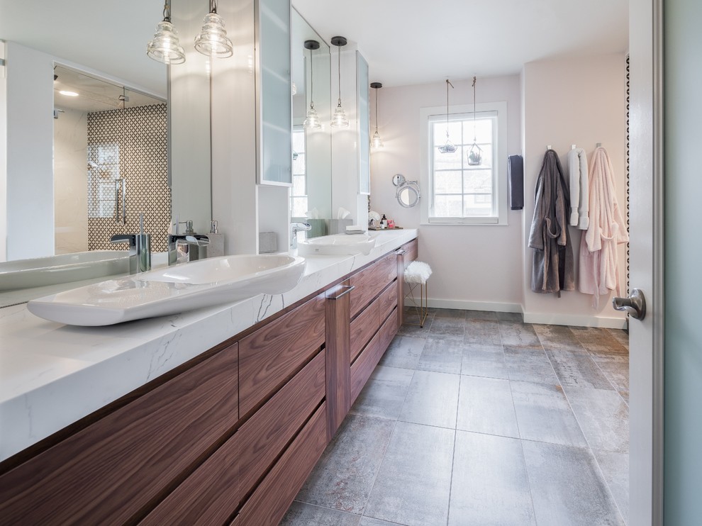 Photo of a large midcentury master bathroom in Denver with flat-panel cabinets, brown cabinets, a corner shower, a two-piece toilet, white tile, ceramic tile, white walls, ceramic floors, a vessel sink, engineered quartz benchtops, grey floor, a hinged shower door and white benchtops.