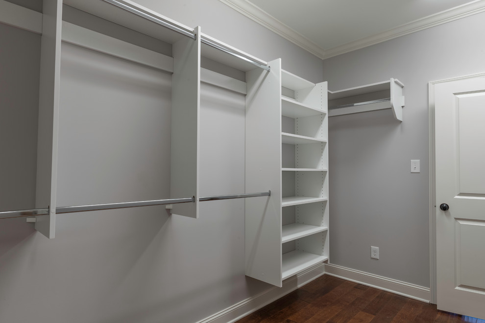 Mid-sized transitional gender-neutral medium tone wood floor walk-in closet photo with open cabinets and white cabinets