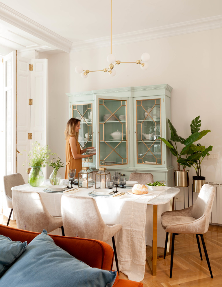 Inspiration for a large transitional open plan dining in Other with white walls, medium hardwood floors, a ribbon fireplace, a tile fireplace surround and multi-coloured floor.