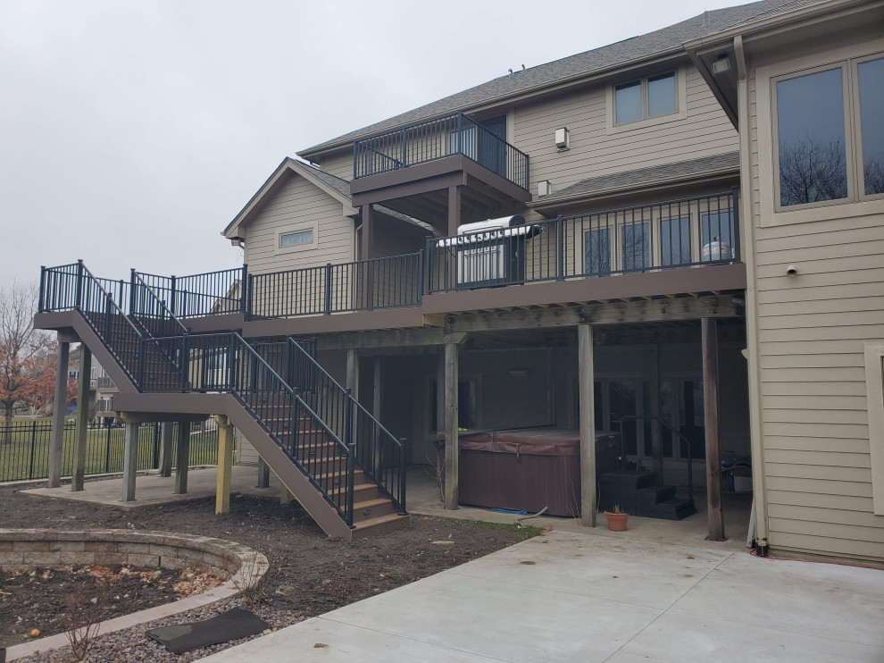 Deck - large backyard second story metal railing deck idea with no cover
