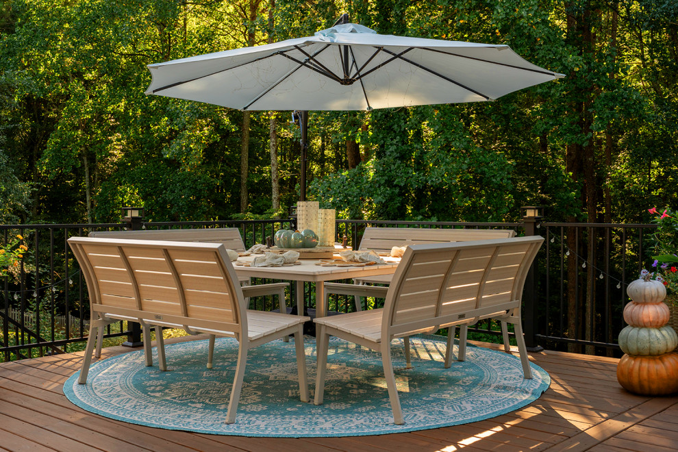 Example of a transitional backyard second story metal railing deck design in Atlanta with a bbq area and no cover