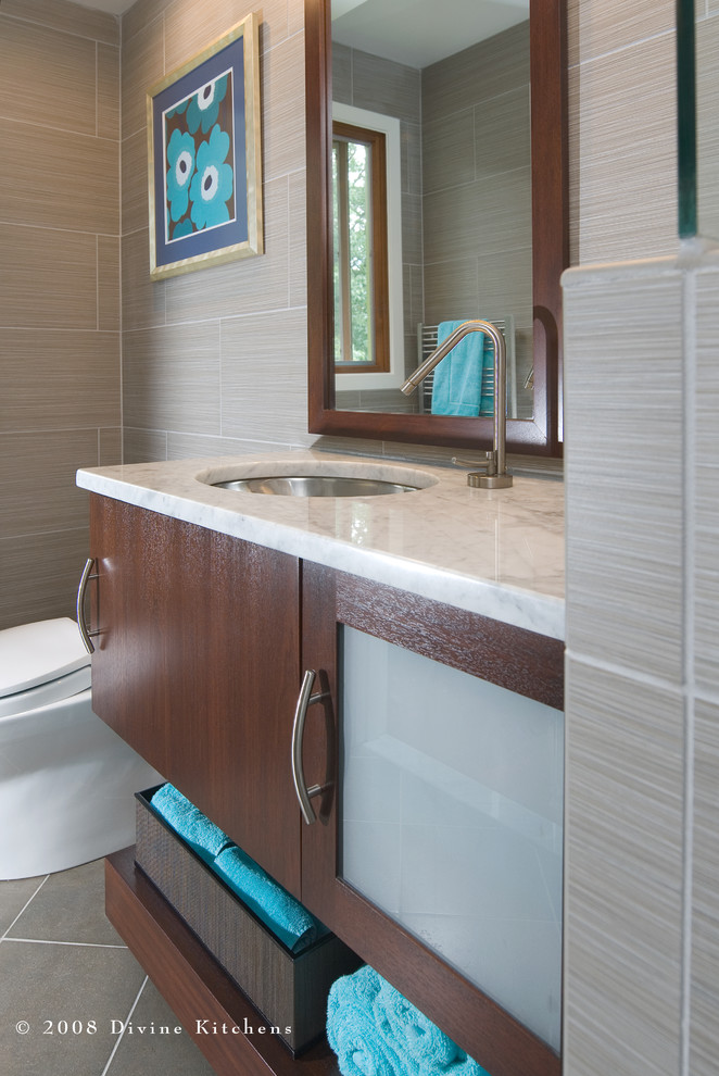 Design ideas for a large contemporary master bathroom in Boston with an undermount sink, flat-panel cabinets, dark wood cabinets, marble benchtops, a corner shower, a two-piece toilet, beige tile, ceramic tile, beige walls and ceramic floors.