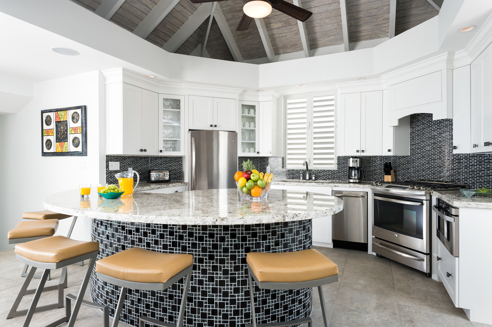 Example of a transitional kitchen design with shaker cabinets, multicolored backsplash and stainless steel appliances
